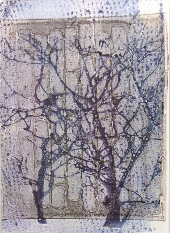 An abstract image showing what might be trees in muddy tones, overprinted with a tan/gold abstract pattern and what looks like the weave of paper towel in blue ink.